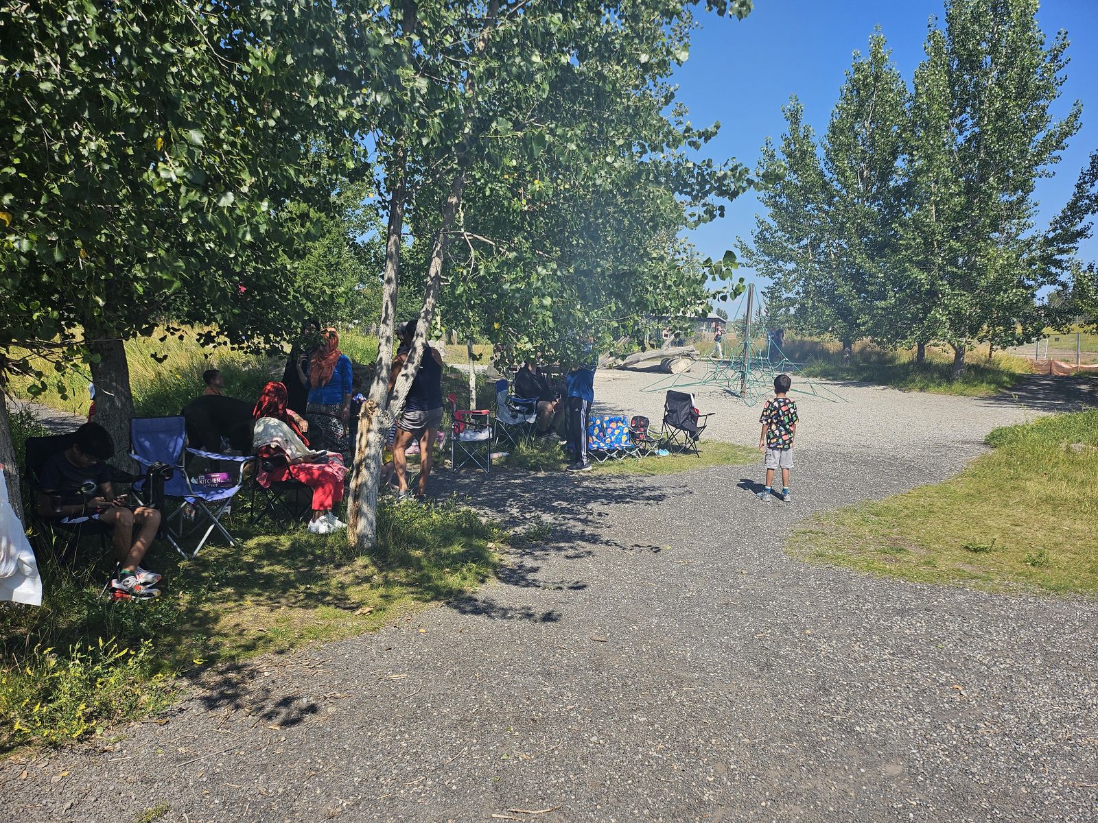 Outdoor Muslims of Cochrane family gathering in summer