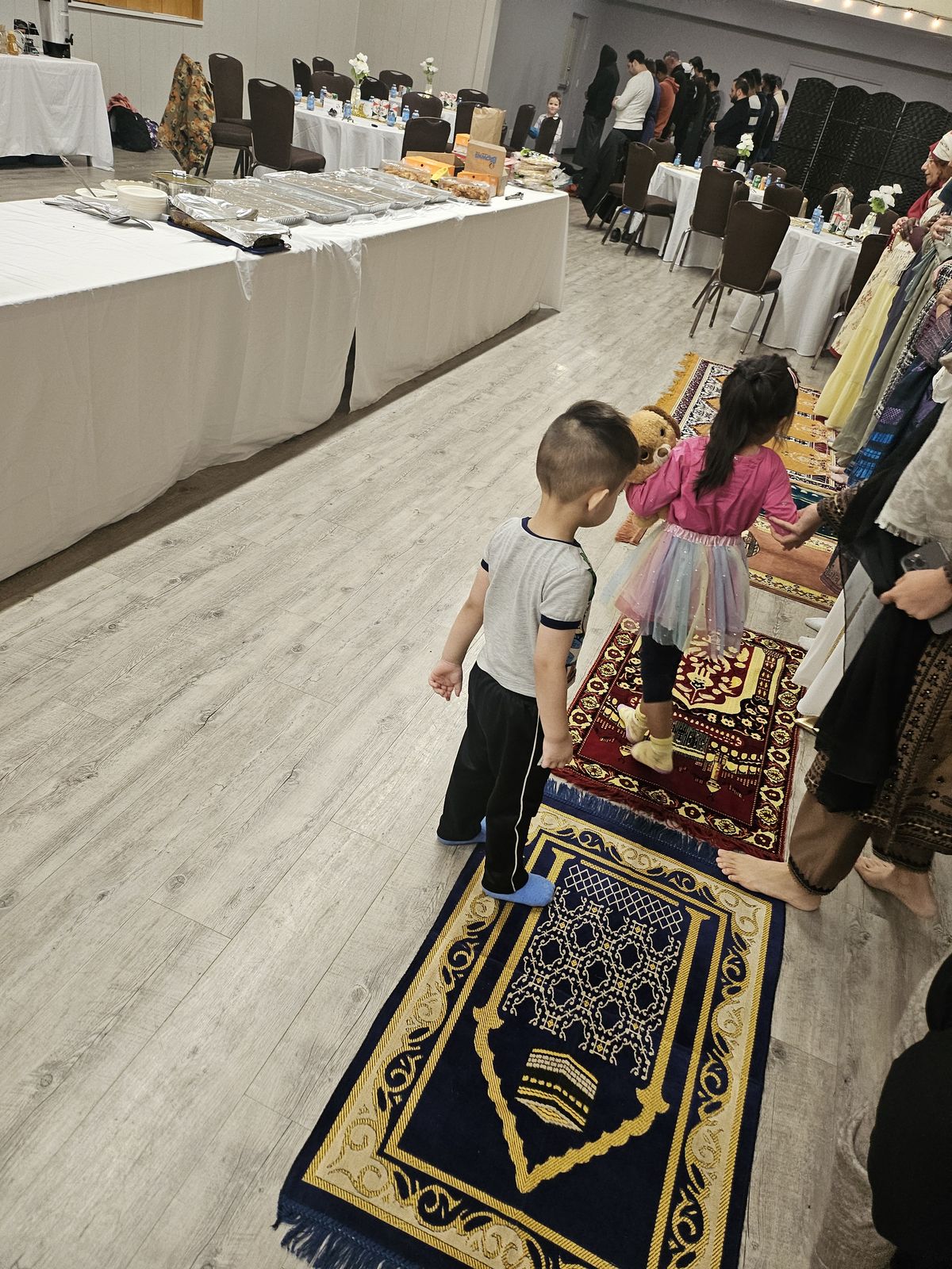 Children participating in an indoor community celebration